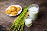 Almond Cookies With Rice Milk And Ear Of Rice  On Old Wooden Tab Stock Photo