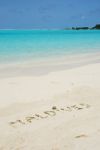 Maldives Written In A Sandy Tropical Beach Stock Photo