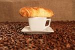 Coffee Beans And Croissant Stock Photo