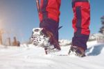 View Of Walking On Snow With Snow Shoes And Shoe Spikes In Winte Stock Photo