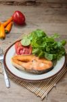 Salmon Steak On Wooden Table Stock Photo