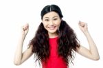 Cheerful Woman With Clenched Fists Stock Photo