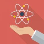 Hand Holding Atom Symbol Stock Photo