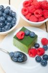 Green Tea Matcha Mousse Cake With Berries Stock Photo