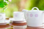 White Porcelain Set For Tea Or Coffee On Wooden Table Stock Photo