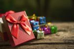 Red Gift Box On Old  Wood Floor  For Multipurpose Gift Festival Stock Photo