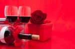 St Valentine's Setting With Present And Red Wine Stock Photo