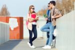 A Group Of Friends Talking In The Street After Class Stock Photo