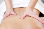 Woman Enjoying Shoulder Massage At Beauty Spa Stock Photo