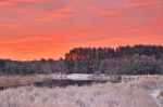 Colorful Autumn Dawn. Red Sky And Clouds. First Snow In The Autu Stock Photo