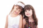 Friends - Two Adorable Little Girls Isolated On White Background Stock Photo