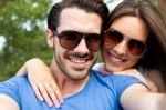 Happy Young Couple Taking Selfies With Her Smartphone In The Par Stock Photo