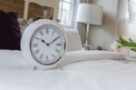 Classic White Alarm Clock Style In Classic Bedroom Stock Photo