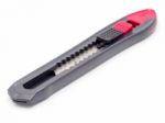 Black And Red Plastic Cutter Knife Isolated Stock Photo