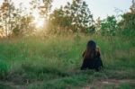 Relax Woman And Sunset Silhouette Stock Photo