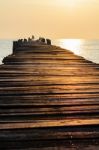 Old Wooden Pier At Sunrise Stock Photo