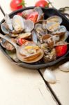 Fresh Clams On An Iron Skillet Stock Photo