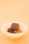 Chocolate Pieces On On Warm Vintage Background Stock Photo