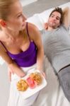 Couple Having Breakfast In Bed Stock Photo