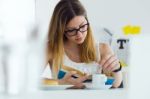 Pretty Young Woman Reading A Book And Having Breakfast At Home Stock Photo