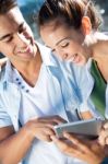 Young Couple Using A Digital Tablet Stock Photo