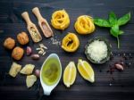 The Ingredients For Green Pesto Sauce On Dark Wooden Background Stock Photo