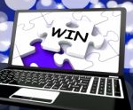 Win Puzzle On Laptop Shows Victory Stock Photo