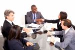 Multi Ethnic Team During Meeting Stock Photo