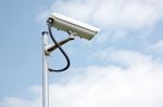 Cctv Camera On Blue Sky Background Stock Photo