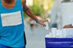 Marathon Racer Holing Cup Of Water Stock Photo