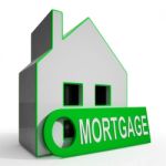 Mortgage House Shows Owing Money For Property Stock Photo