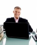 Businessman At Desk with laptop Stock Photo