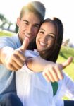 Young Couple Having Fun In A Park Stock Photo