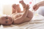 Mom Carefully Clean Baby Skin With Wet Wipes Stock Photo