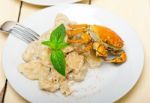 Italian Gnocchi With Seafood Sauce With Crab And Basil Stock Photo