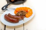 Beef Sausages Cooked On Iron Skillet Stock Photo