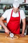 Slicing Pizza Before Delivery Stock Photo