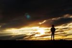 The Lonely Girl At Sunset Stock Photo