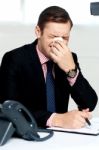 Young Man Having Severe Cold. Sneezing Stock Photo