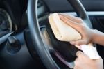 Close Up Hand Cleansing Car Dashboard Stock Photo