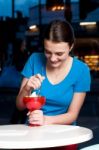 Girl Eating Tempting Dessert Stock Photo