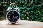 Alarm Clock On Wooden Background Stock Photo