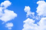 Blue Sky Background With White Clouds Stock Photo