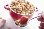 Eating Muesli And Fruit Stock Photo