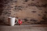 Cup And Heart With Love On Wooden Floor Stock Photo