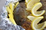 Baked Herring In Spices And Herbs In Foil Stock Photo