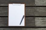 Blank White Paper Sheet On Clipboard And Black Pen Stock Photo