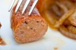 Beef Sausages Cooked On Iron Skillet Stock Photo