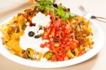 Fresh Nachos And Vegetable Salad With Meat Stock Photo