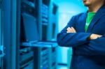 Man Fix Server Network In Data Center Room Stock Photo